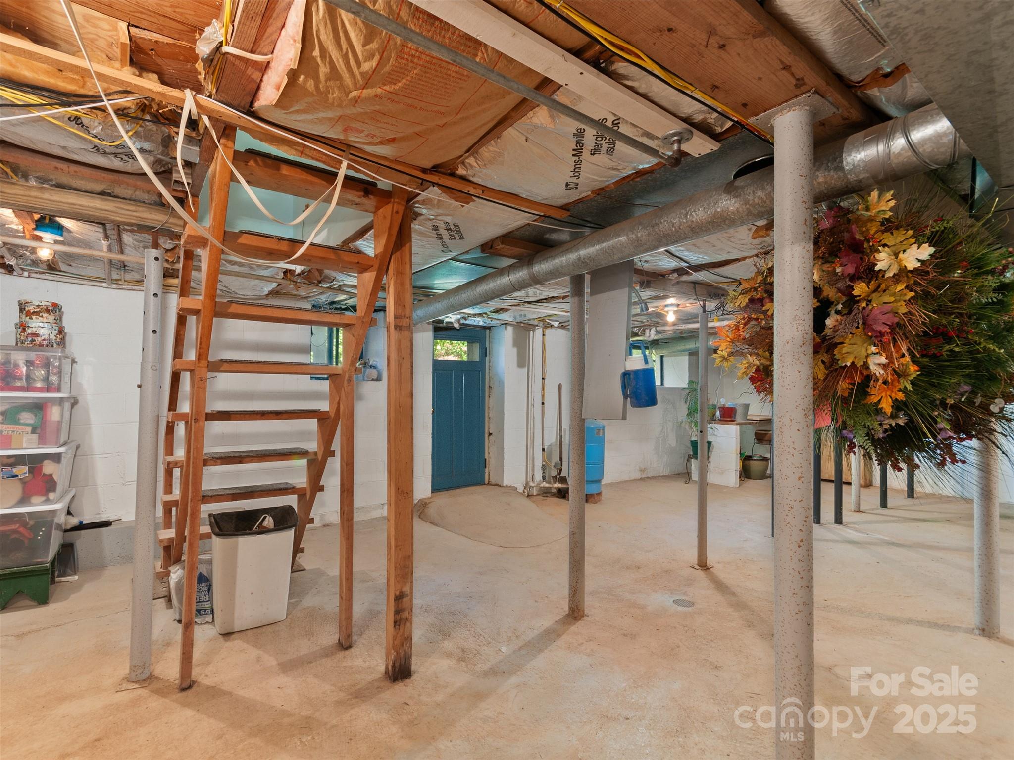 229 Crabtree Mountain Road Canton, NC 28716 - Photo 37 of 42 a view of an empty room with wooden floor