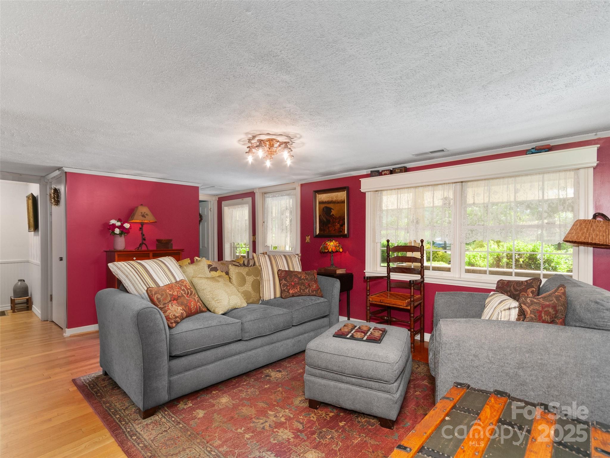 229 Crabtree Mountain Road Canton, NC 28716 - Photo 7 of 42 a living room with furniture and a large window