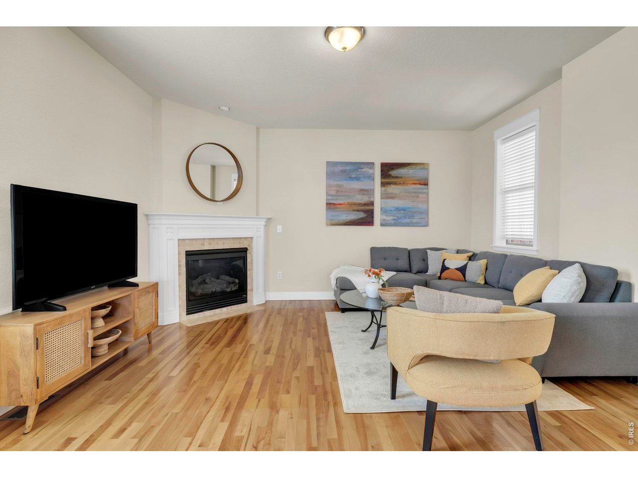 696 Homestead Street Lafayette, CO 80026 - Photo 12 of 49 a living room with furniture and a flat screen tv