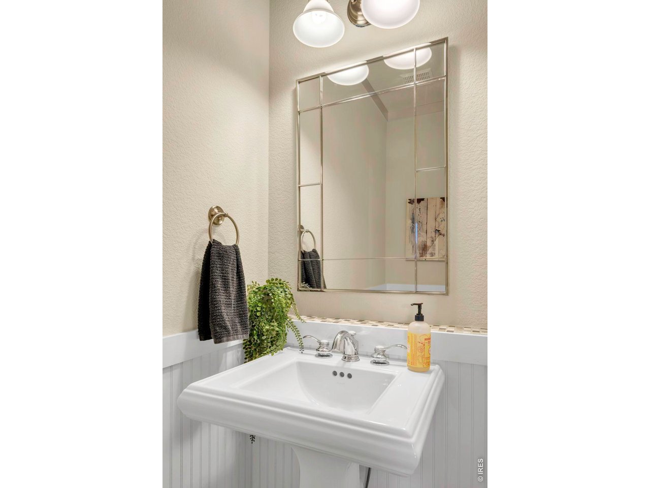696 Homestead Street Lafayette, CO 80026 - Photo 15 of 49 a bathroom with a sink and a mirror