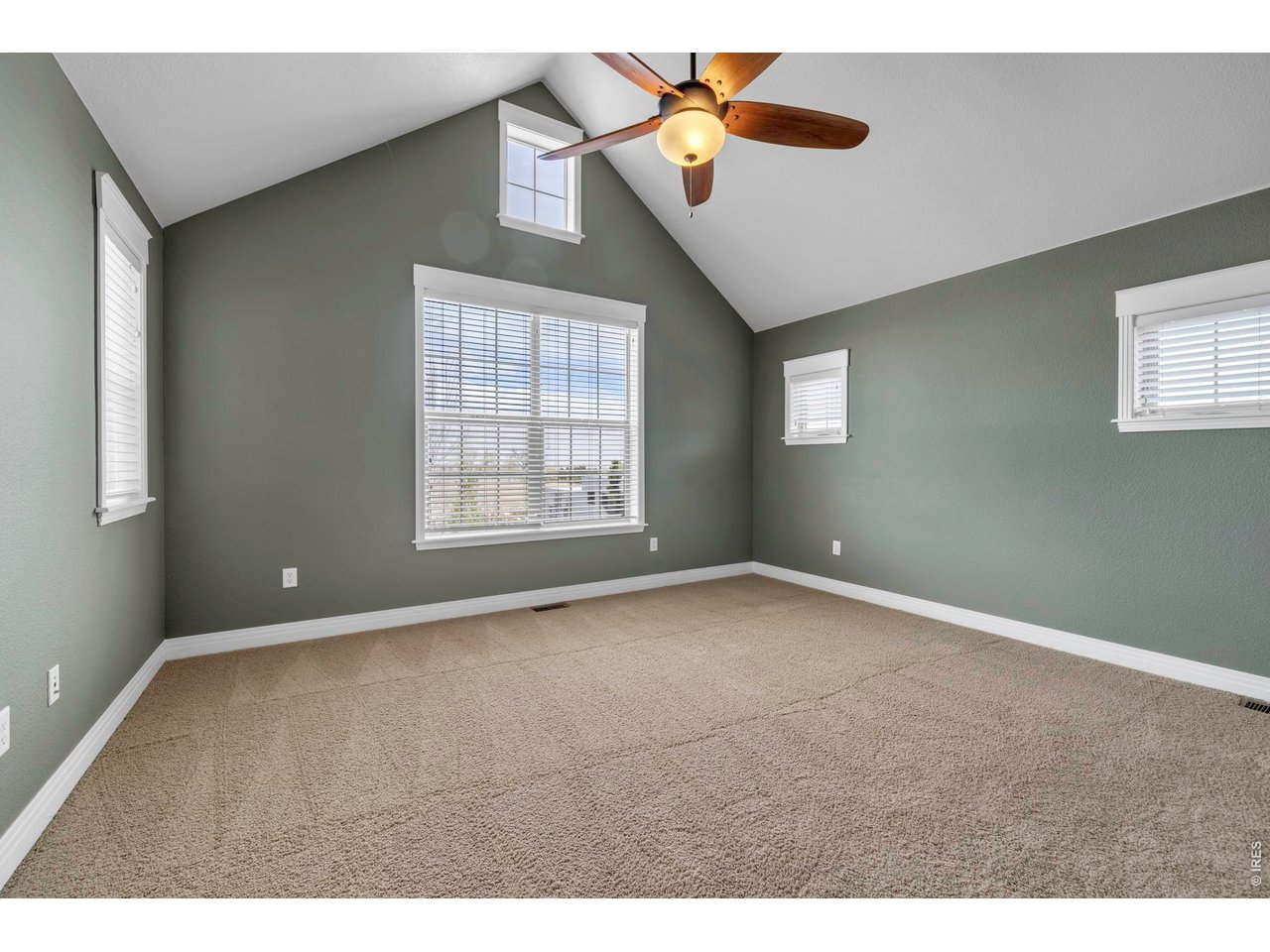 696 Homestead Street Lafayette, CO 80026 - Photo 25 of 49 a view of an empty room with windows