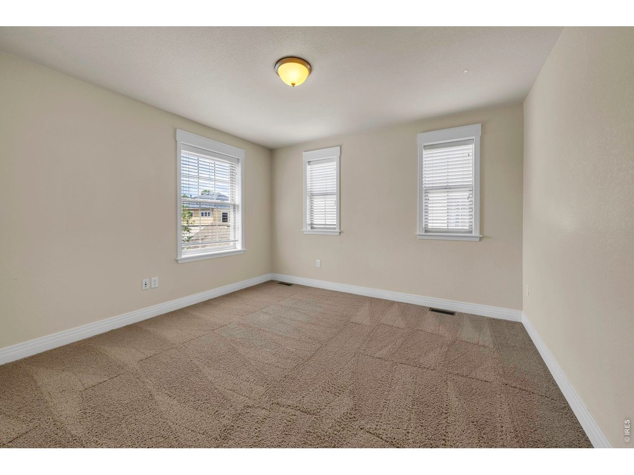 696 Homestead Street Lafayette, CO 80026 - Photo 32 of 49 a view of an empty room with a window