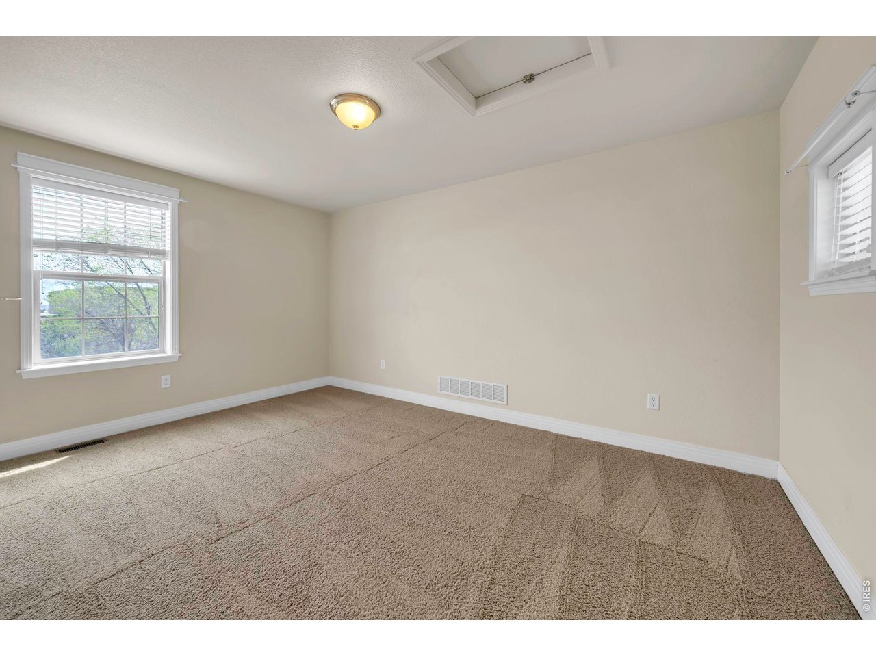 696 Homestead Street Lafayette, CO 80026 - Photo 34 of 49 a view of an empty room with a window