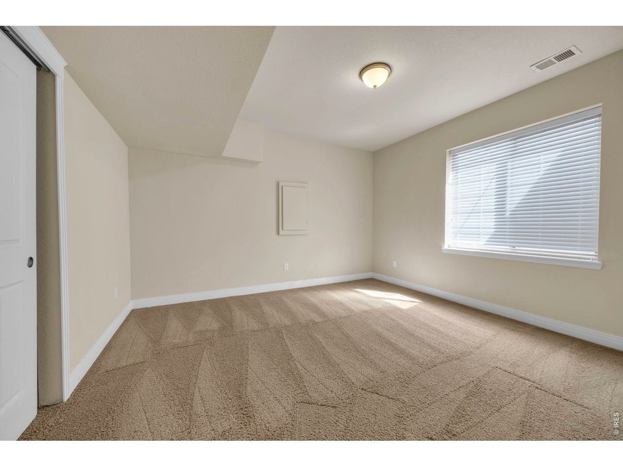 696 Homestead Street Lafayette, CO 80026 - Photo 38 of 49 a view of an empty room with a window