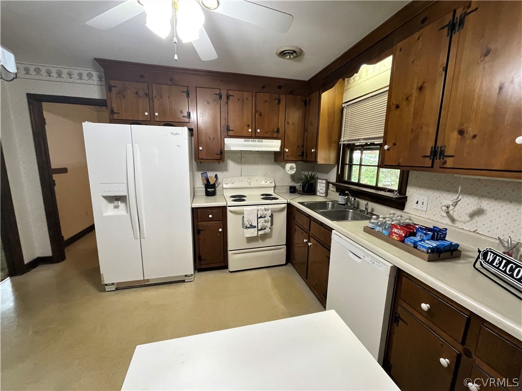 3933 Bronholly Road Chesterfield, VA 23832 - Photo 4 of 20 a kitchen with a sink a refrigerator a window and cabinets