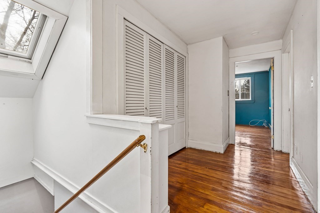110 Killam Hill Road Boxford, MA 01921 - Photo 24 of 40 a view of an empty room with wooden floor and a window