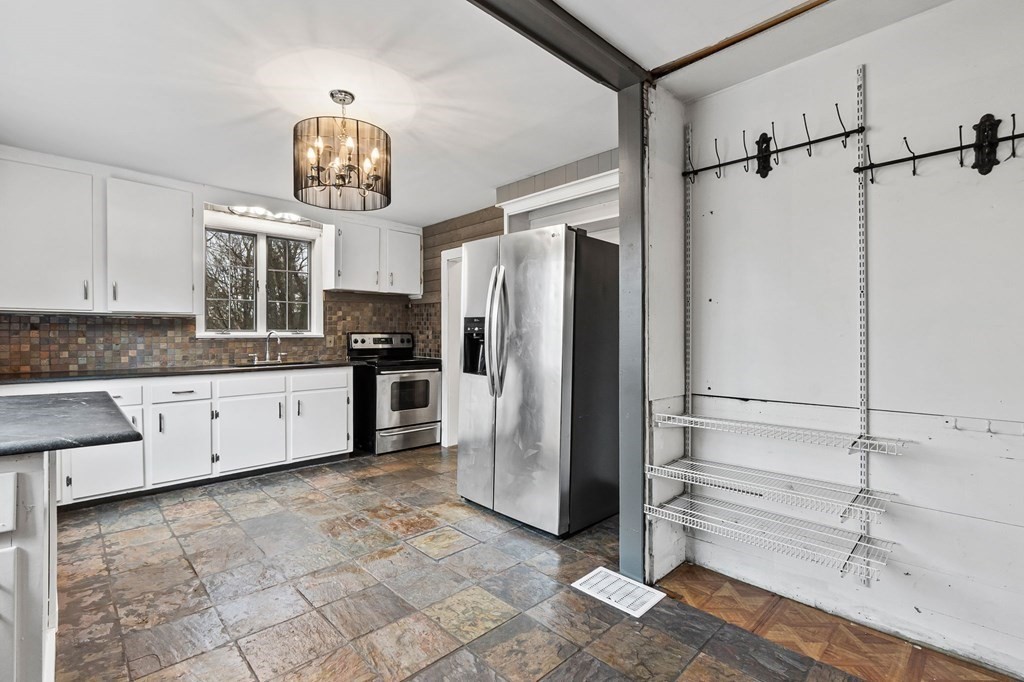 110 Killam Hill Road Boxford, MA 01921 - Photo 8 of 40 a kitchen with a refrigerator and a sink