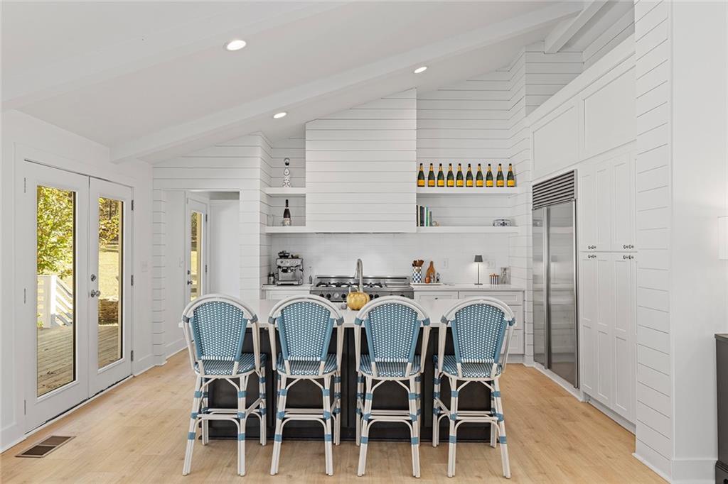 12005 Hamilton Road Chattahoochee Hills, GA 30268 - Photo 12 of 51 a view of a dining room with furniture and wooden floor
