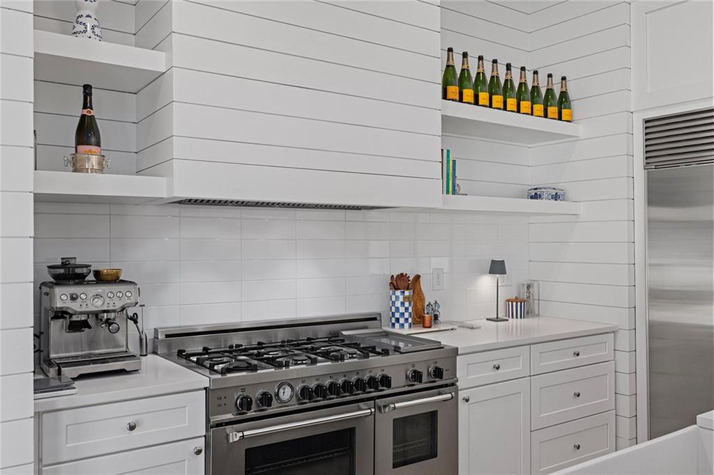 12005 Hamilton Road Chattahoochee Hills, GA 30268 - Photo 13 of 51 a kitchen with stainless steel appliances a stove and cabinets