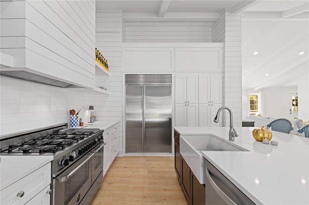 12005 Hamilton Road Chattahoochee Hills, GA 30268 - Photo 14 of 51 a kitchen with kitchen island a sink stove and refrigerator
