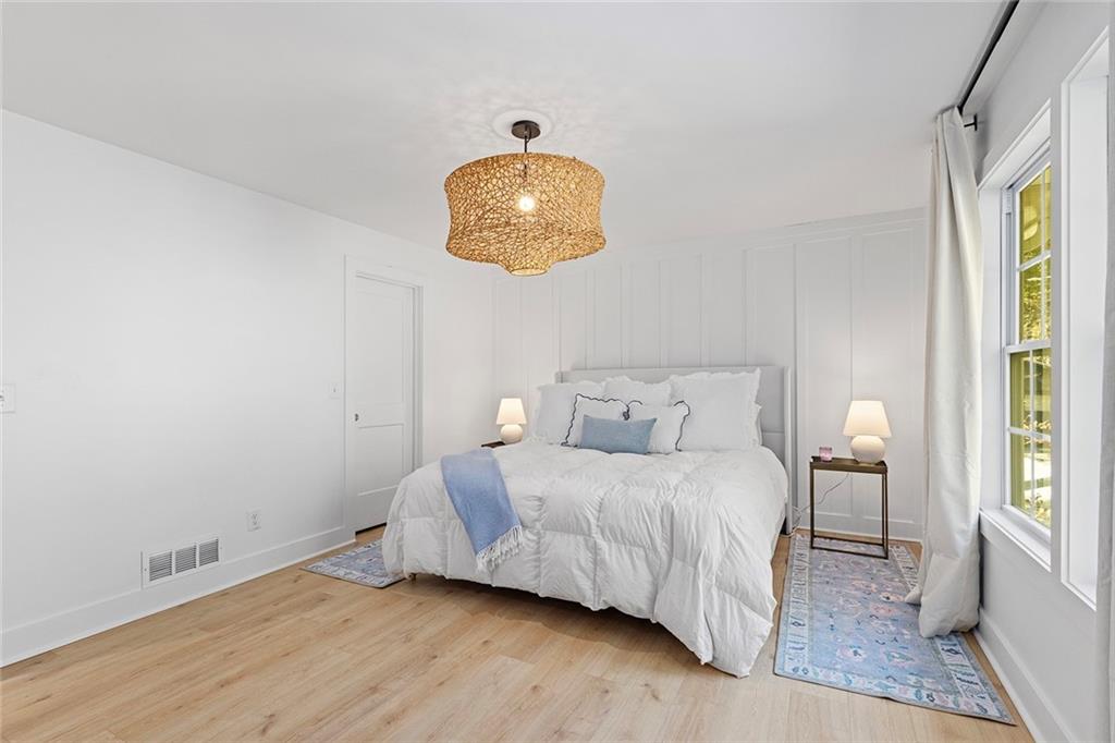 12005 Hamilton Road Chattahoochee Hills, GA 30268 - Photo 19 of 51 a bedroom with a bed and a painting on the wall