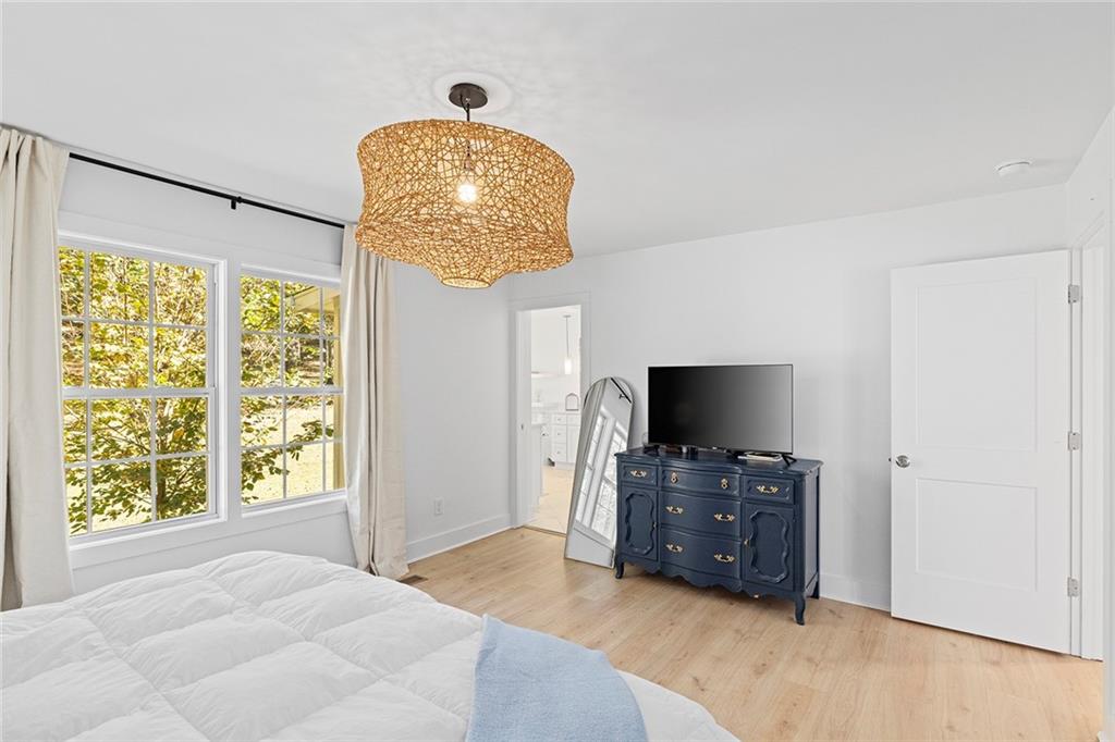 12005 Hamilton Road Chattahoochee Hills, GA 30268 - Photo 20 of 51 a living room with furniture and a flat screen tv