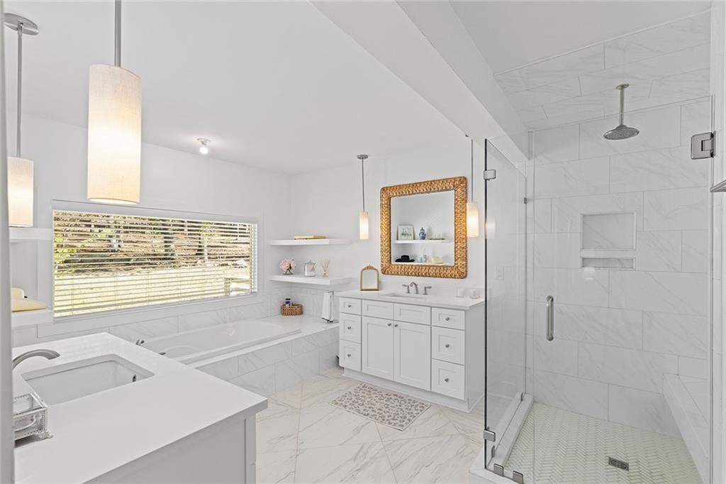 12005 Hamilton Road Chattahoochee Hills, GA 30268 - Photo 21 of 51 a spacious bathroom with a tub sink and mirror
