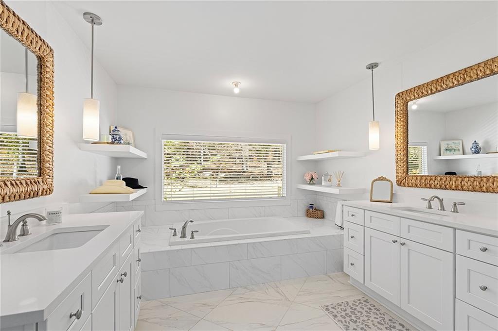 12005 Hamilton Road Chattahoochee Hills, GA 30268 - Photo 22 of 51 a bathroom with a bathtub sink and mirror
