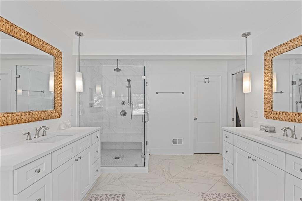 12005 Hamilton Road Chattahoochee Hills, GA 30268 - Photo 24 of 51 a spacious bathroom with double sink shower and a mirror