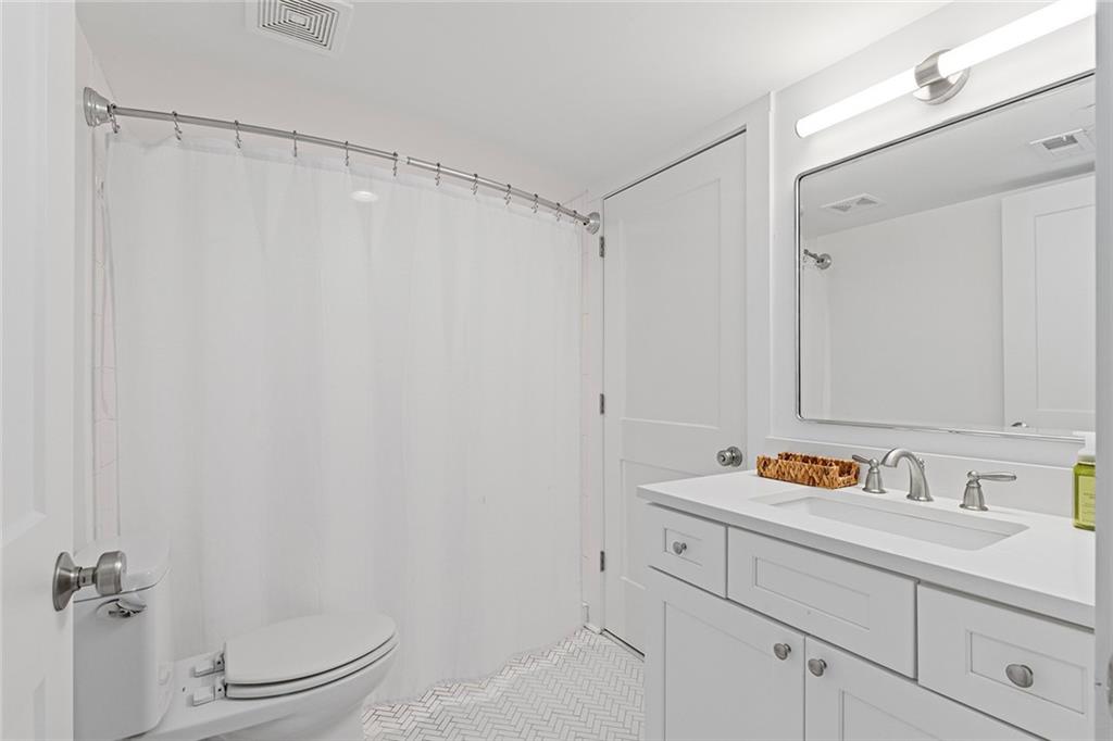 12005 Hamilton Road Chattahoochee Hills, GA 30268 - Photo 33 of 51 a bathroom with a sink and a mirror
