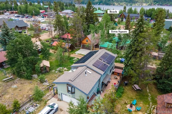an aerial view of multiple houses with yard