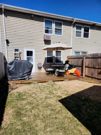 a front view of house with outdoor seating