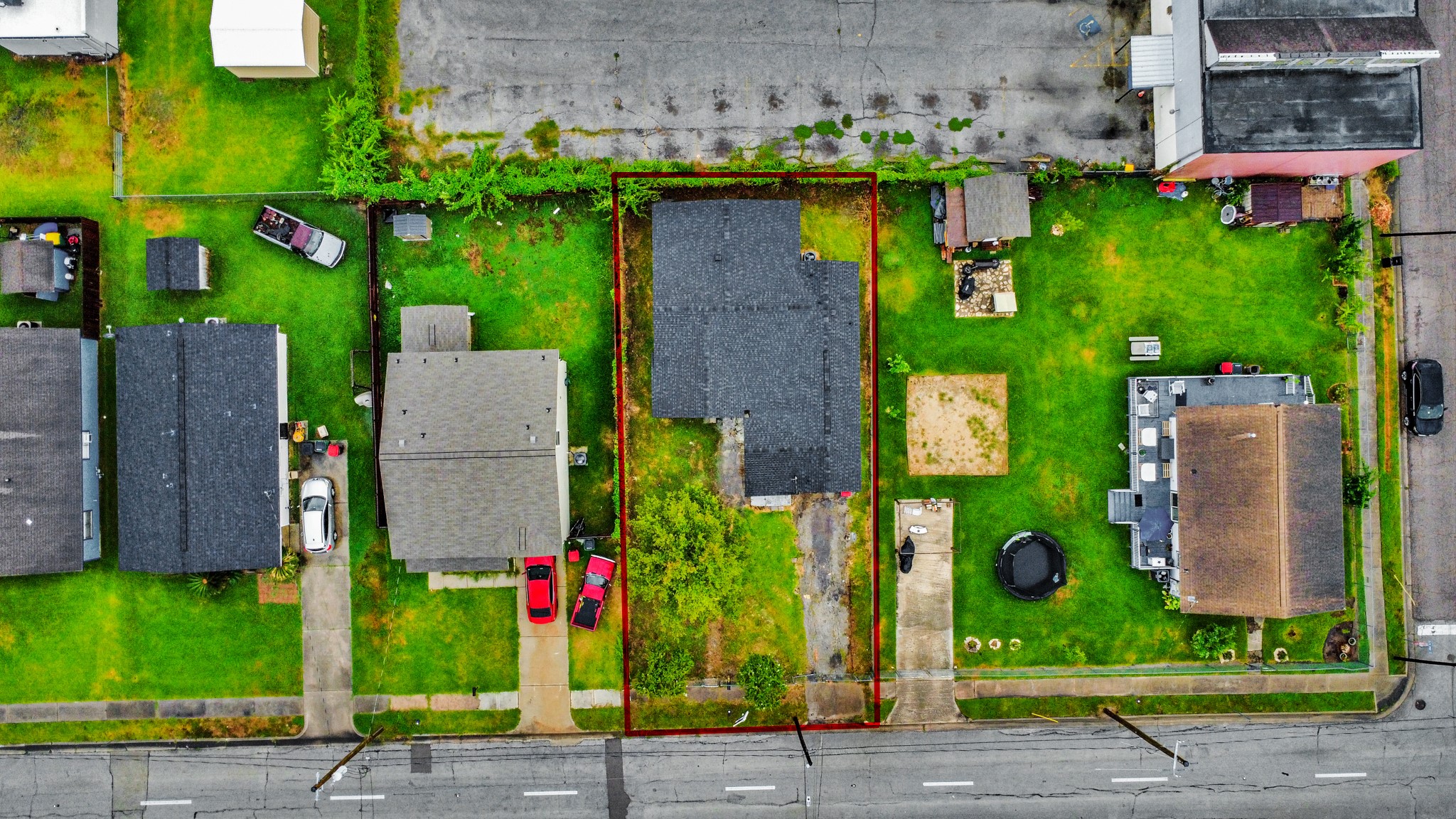 207 East Defee Avenue Baytown, TX 77520 - Photo 32 of 36 a front view of a house with a yard and potted plants
