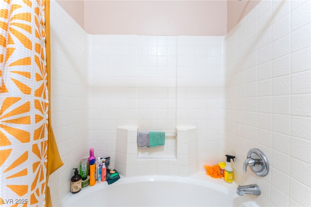 4656 East Desert Inn Road Las Vegas, NV 89121 - Photo 16 of 98 4656 E DI Bathroom featuring shower / bath combination with curtain