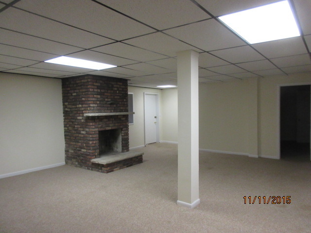 9N052 Corron Road Elgin, IL 60124 - Photo 14 of 19 a view of an empty room with a fireplace