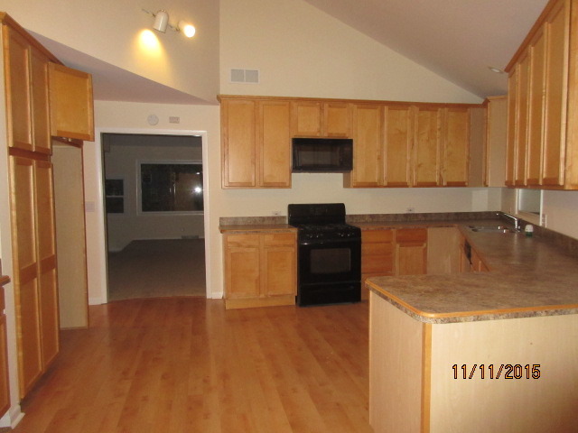 9N052 Corron Road Elgin, IL 60124 - Photo 4 of 19 a kitchen with a refrigerator and a sink