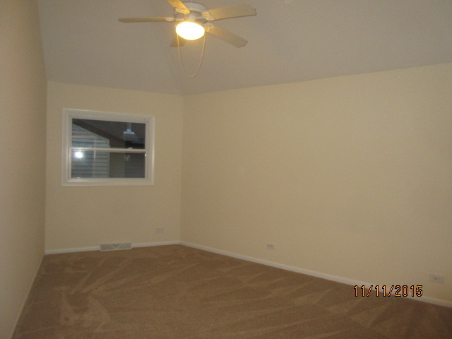 9N052 Corron Road Elgin, IL 60124 - Photo 7 of 19 an empty room with a mirror