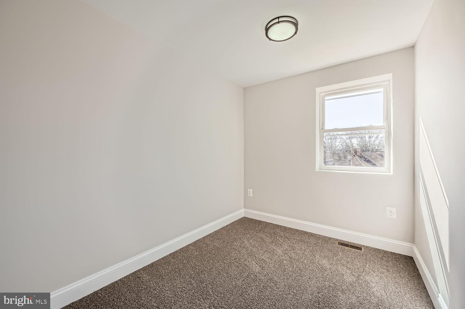 801 Bradhurst Road Baltimore, MD 21212 - Photo 18 of 26 an empty room with a window