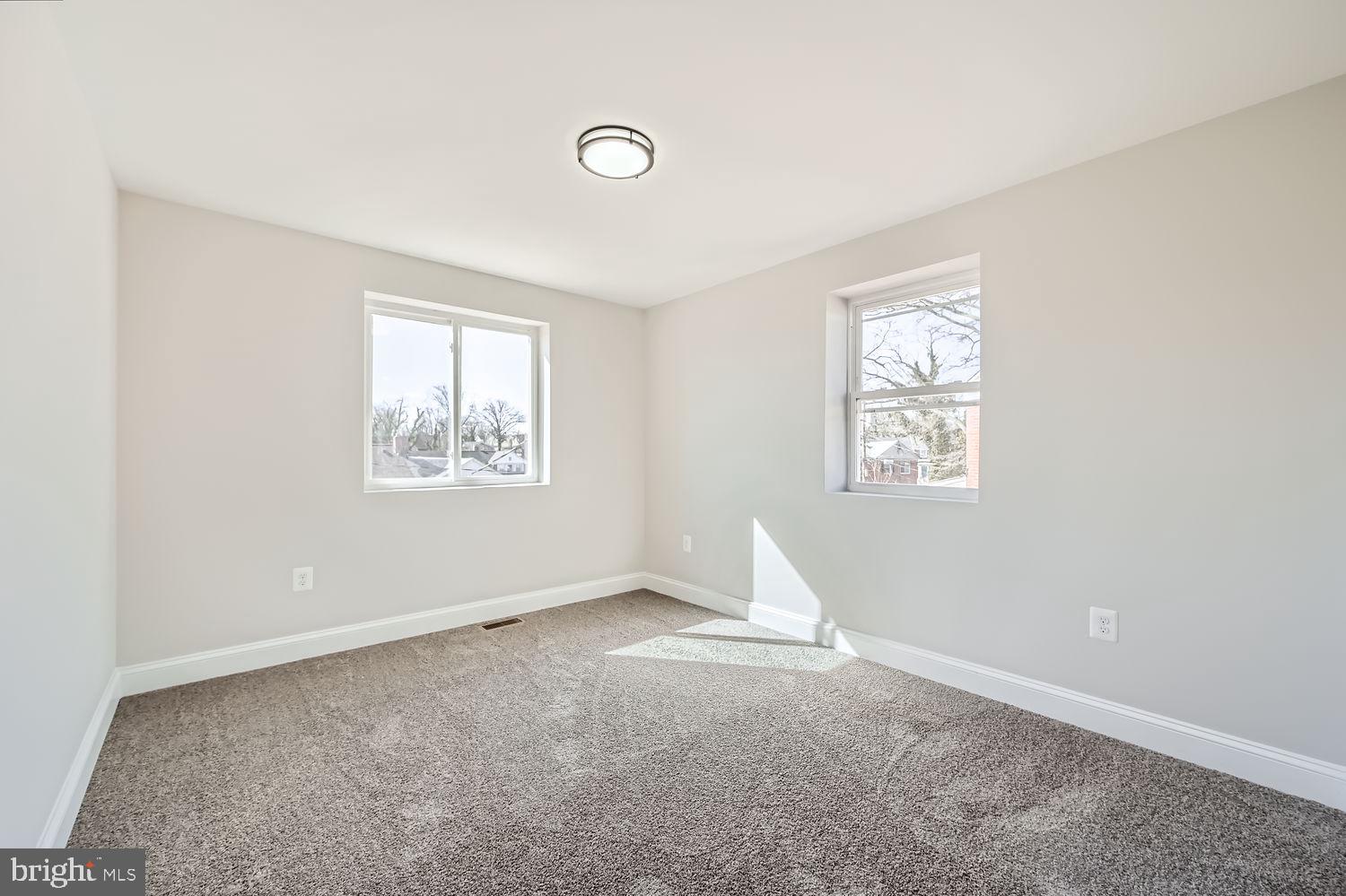 801 Bradhurst Road Baltimore, MD 21212 - Photo 19 of 26 an empty room with windows