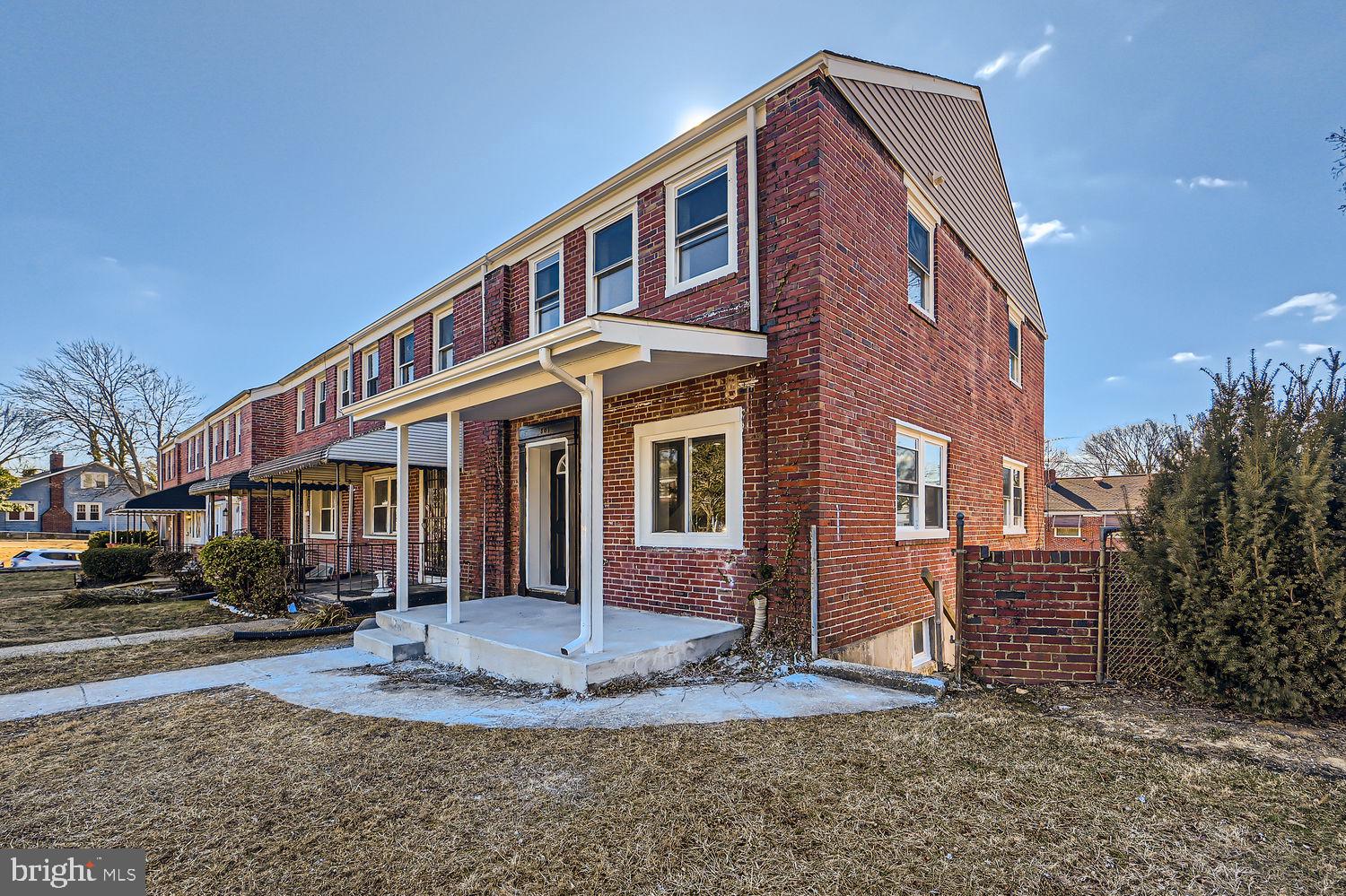 801 Bradhurst Road Baltimore, MD 21212 - Photo 2 of 26 a front view of a house with a yard