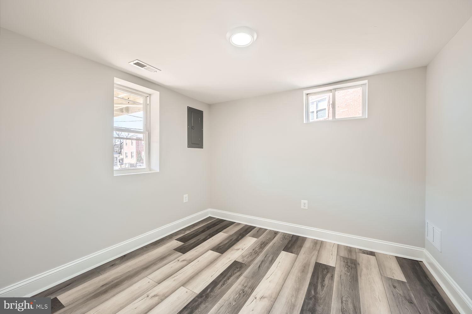 801 Bradhurst Road Baltimore, MD 21212 - Photo 22 of 26 a view of a room with wooden floor and window