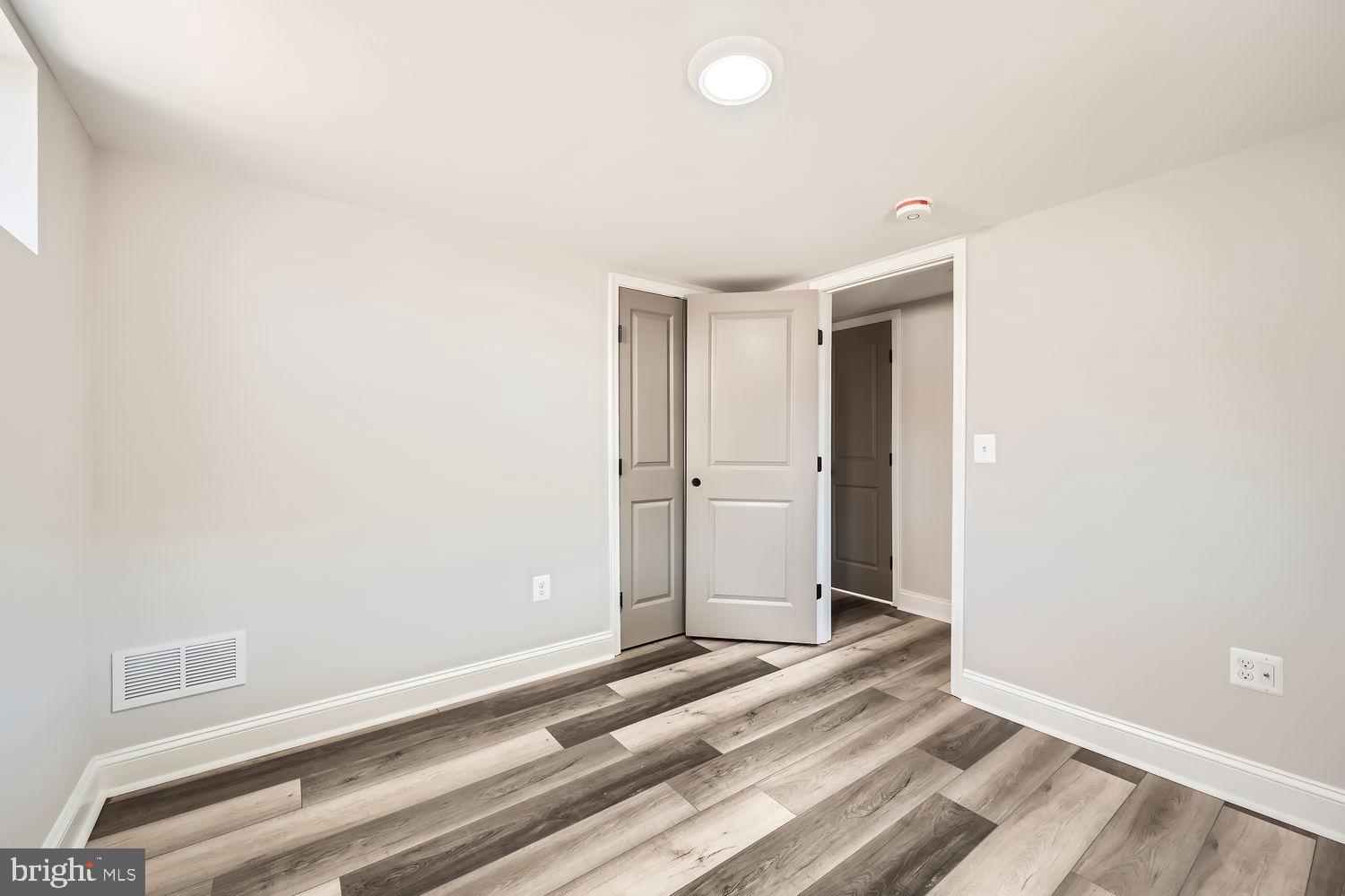 801 Bradhurst Road Baltimore, MD 21212 - Photo 23 of 26 a view of a room with wooden floor and white walls