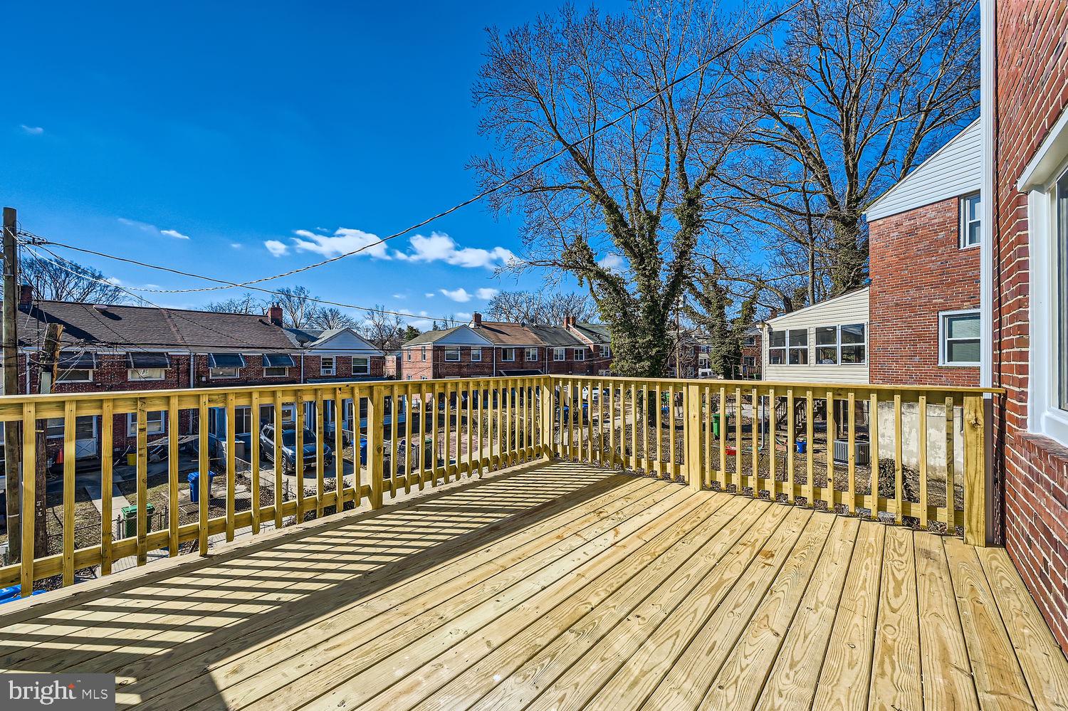 801 Bradhurst Road Baltimore, MD 21212 - Photo 25 of 26 a view of balcony with wooden floor and fence