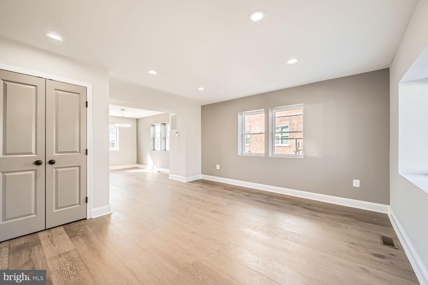 801 Bradhurst Road Baltimore, MD 21212 - Photo 3 of 26 wooden floor in an empty room with a window