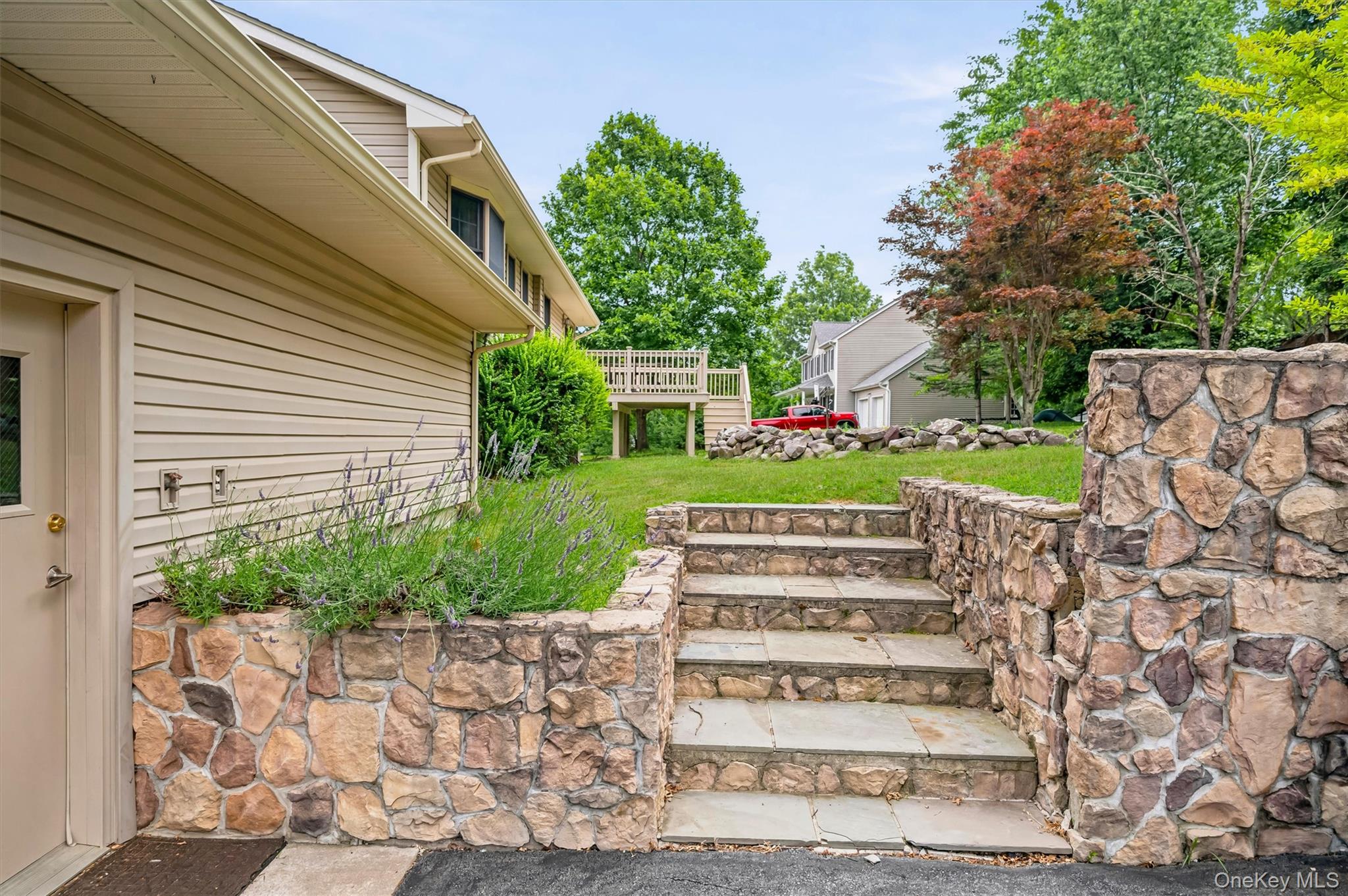 318 Beattie Road Washingtonville, NY 10992 - Photo 33 of 42 a view of a house with a yard and plants