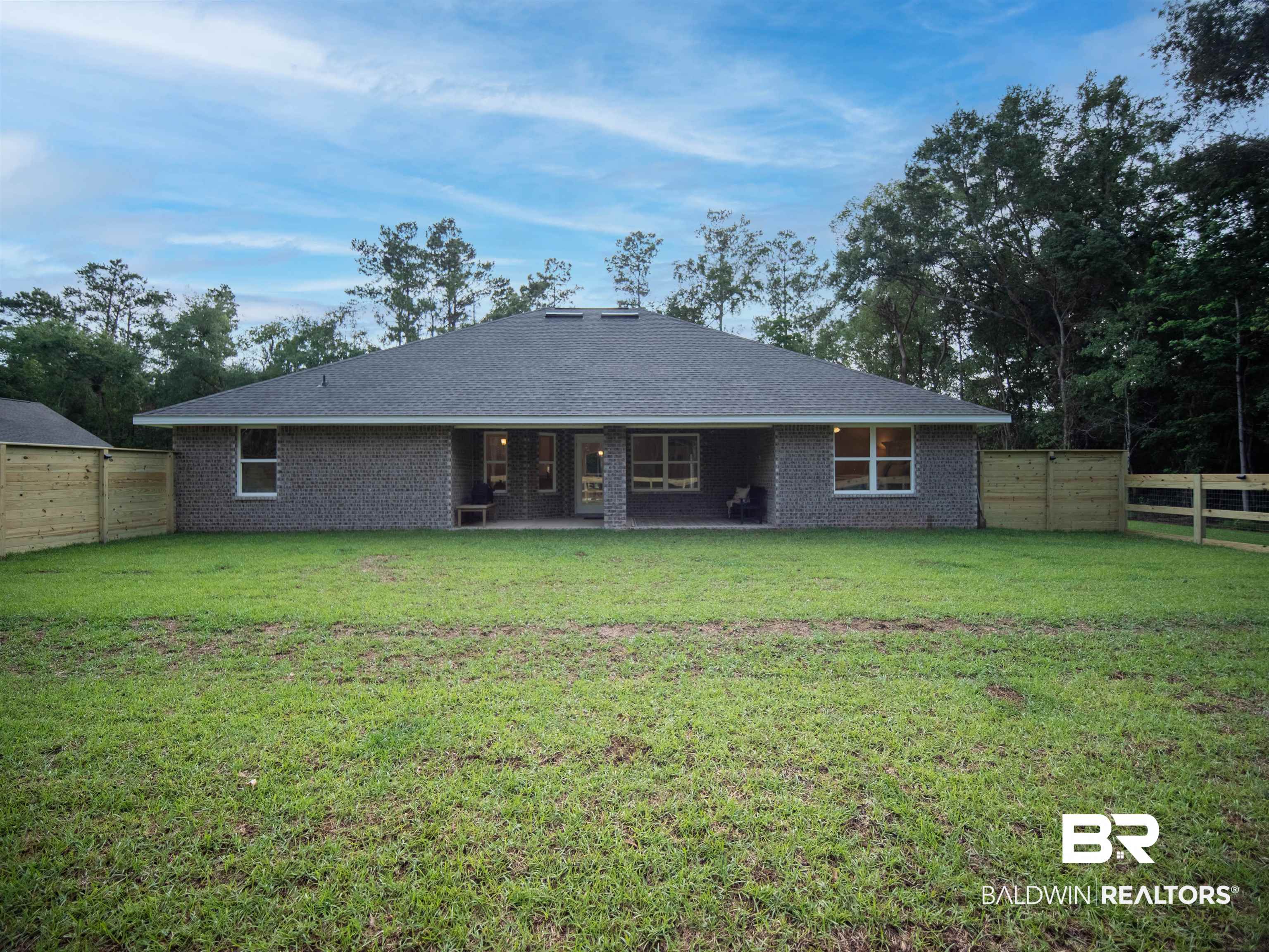 12646 Michigan Avenue Elberta, AL 36530 - Photo 41 of 47 Back of house featuring a fenced backyard and brick siding