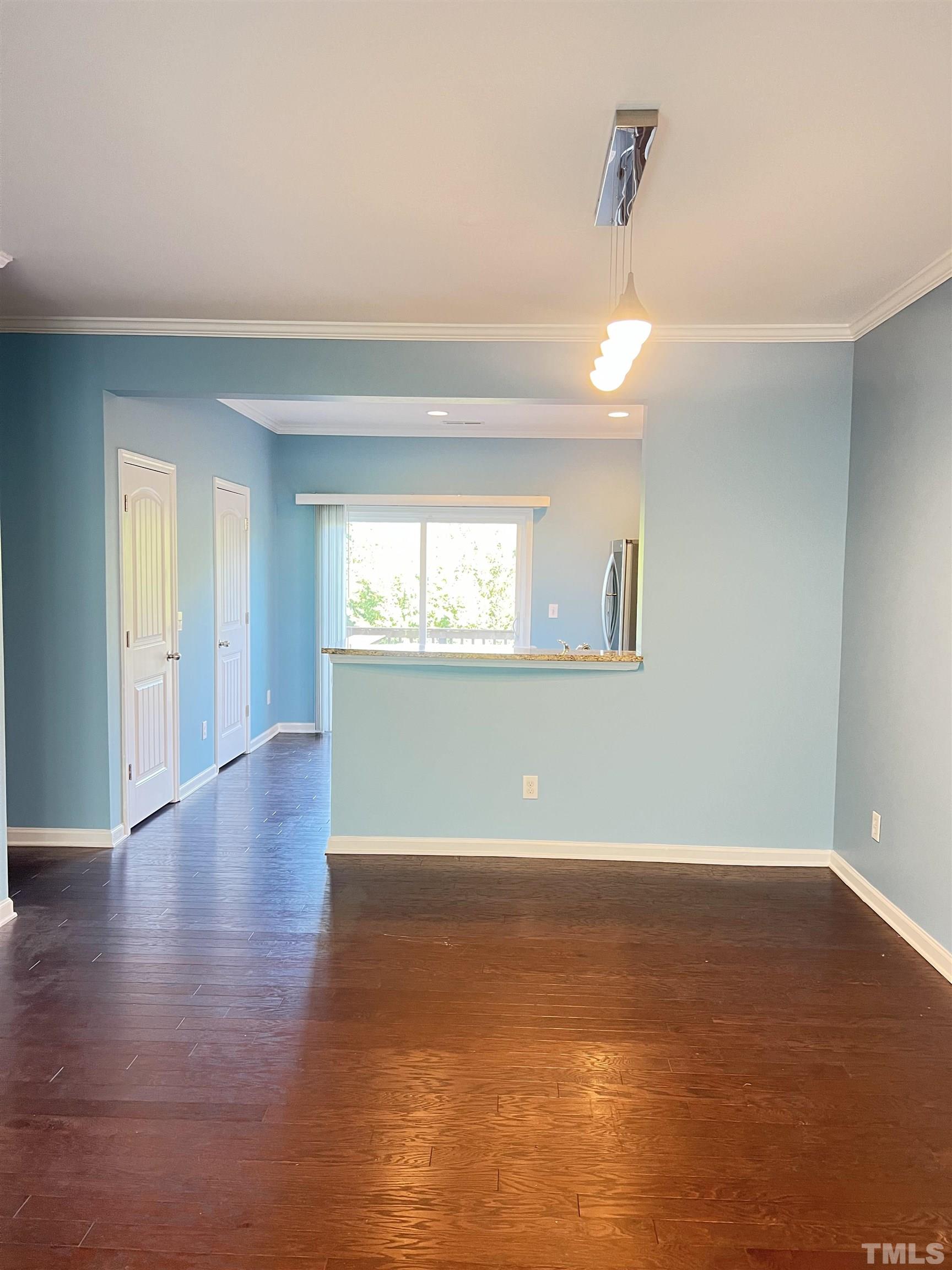 3012 Summerhouse Road Cary, NC 27519 - Photo 11 of 26 a view of a room with wooden floor and windows