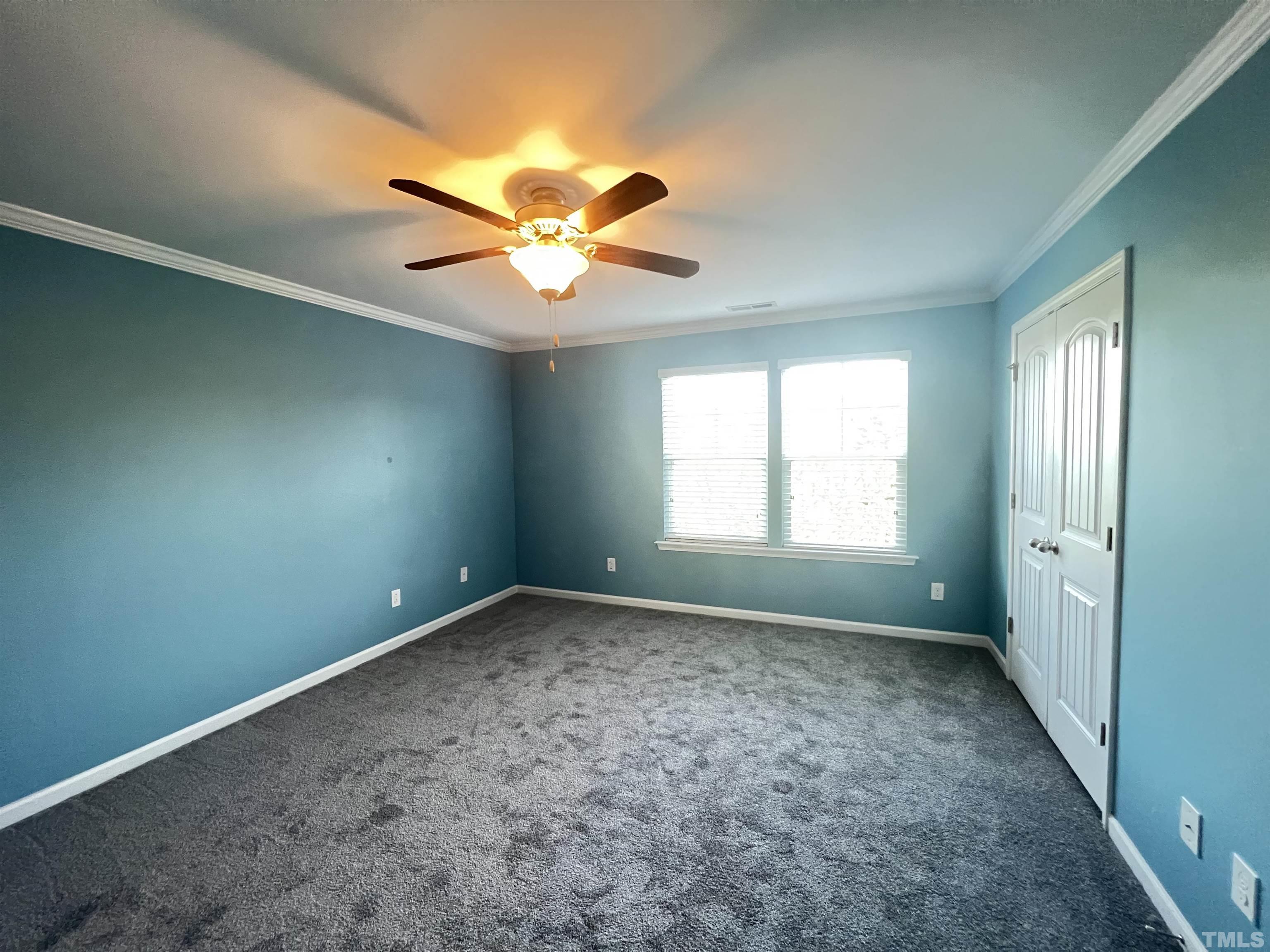 3012 Summerhouse Road Cary, NC 27519 - Photo 19 of 26 an empty room with a window and a fan
