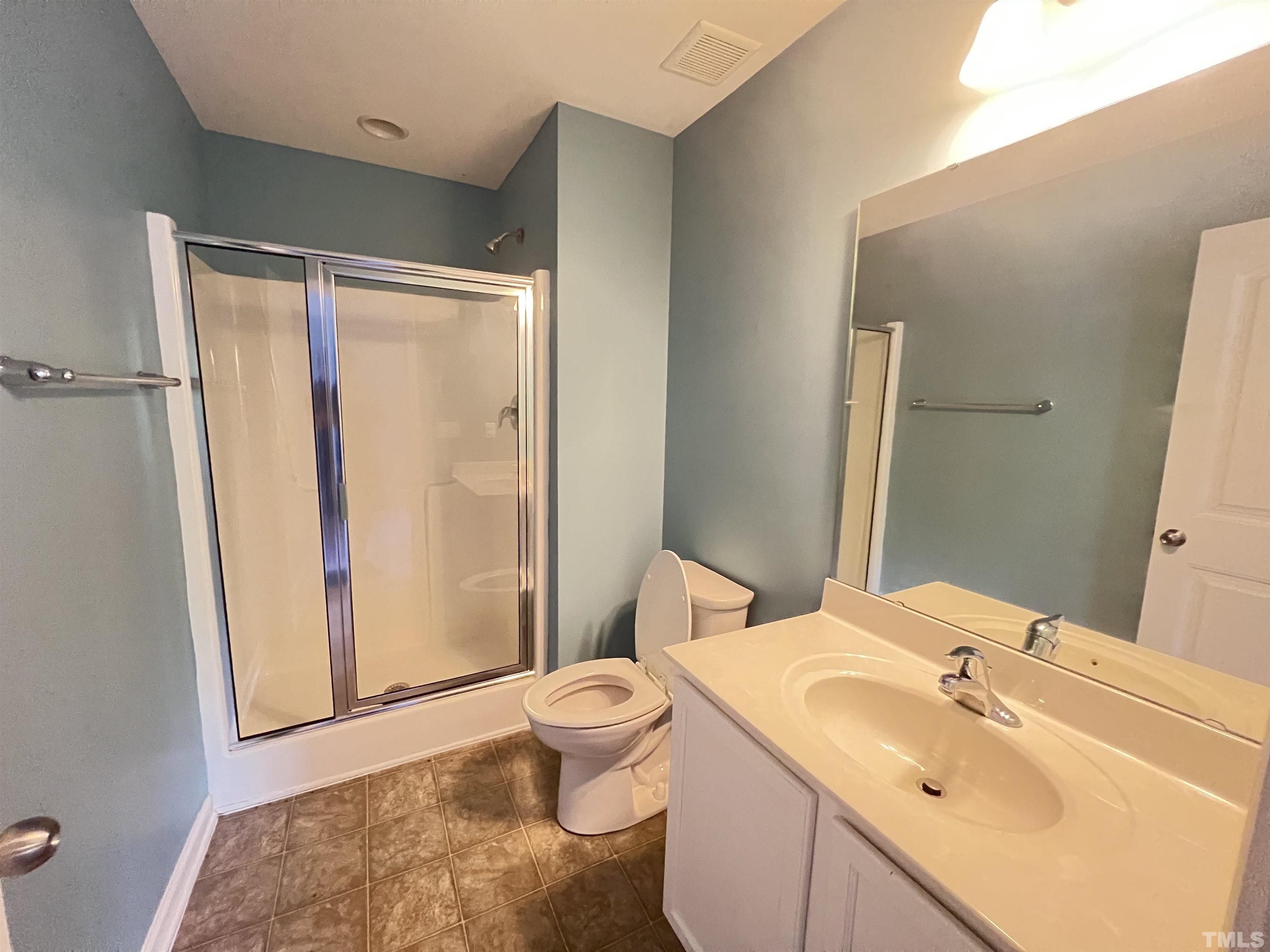3012 Summerhouse Road Cary, NC 27519 - Photo 23 of 26 a bathroom with a sink and a mirror