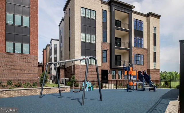 a view of a brick building with many windows