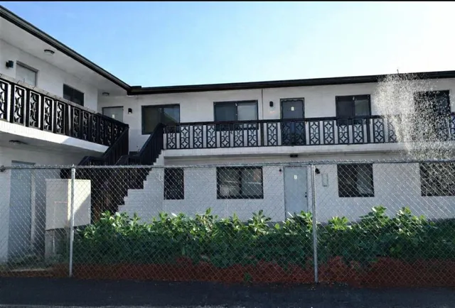 front view of a house with a small yard