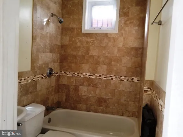 a bathroom with a shower and a toilet
