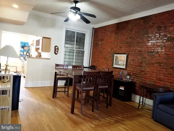 a view of a livingroom with furniture and window