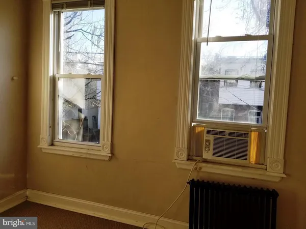 a view of a door and a window