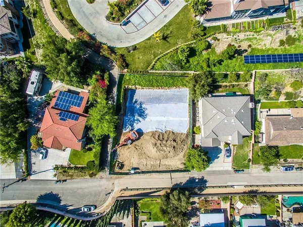 an aerial view of a houses with outdoor space and street view
