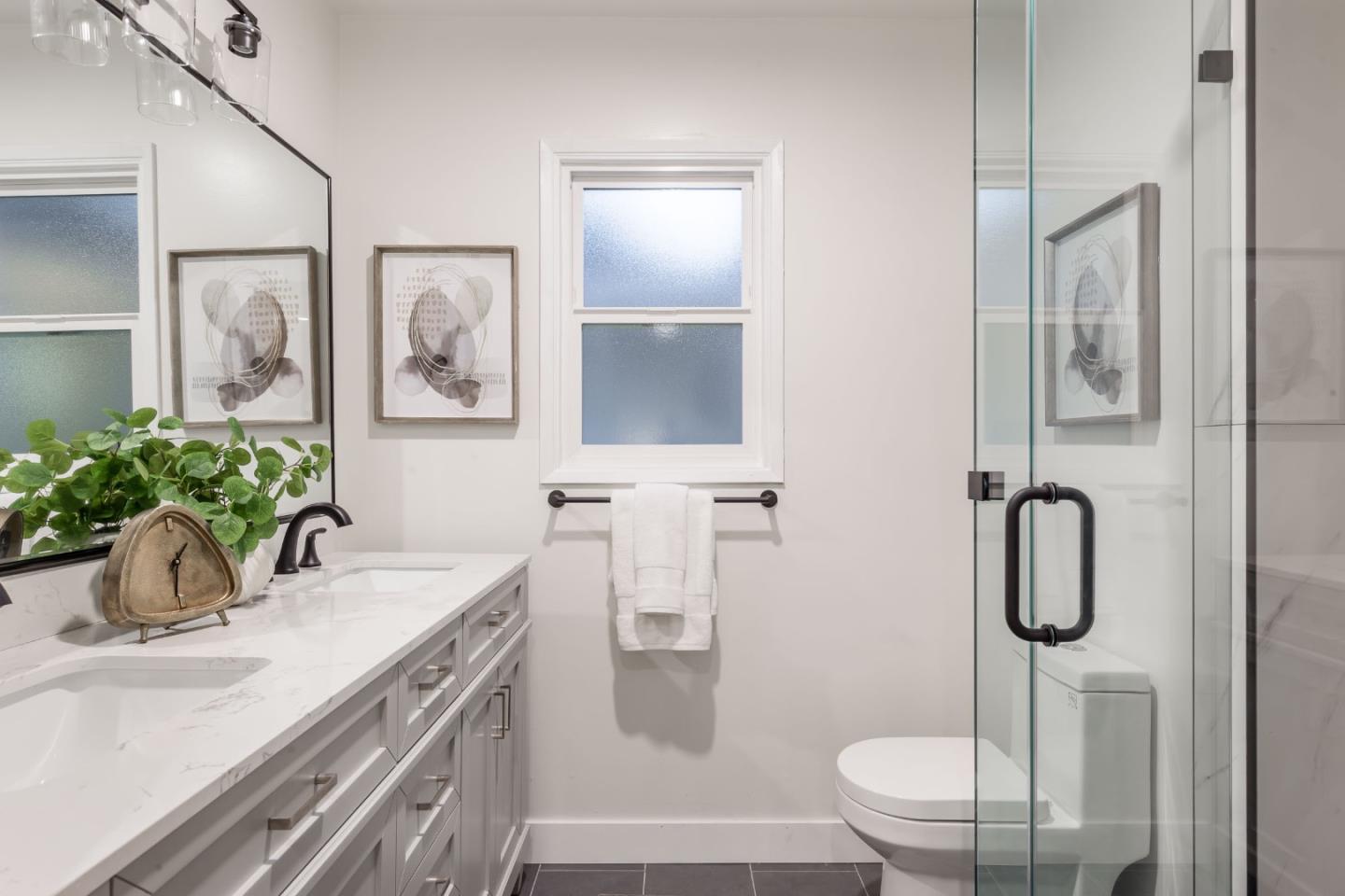 2498 Raleigh Drive San Jose, CA 95124 - Photo 12 of 17 a bathroom with a granite countertop sink a toilet and mirror