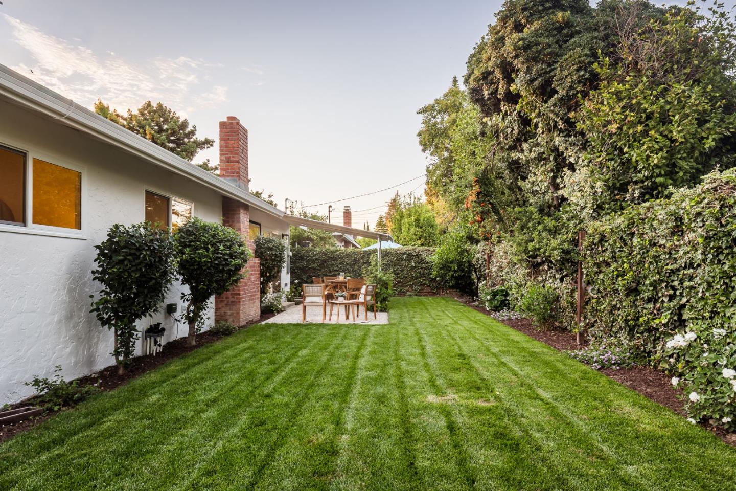 2498 Raleigh Drive San Jose, CA 95124 - Photo 14 of 17 a view of a backyard with plants and a patio