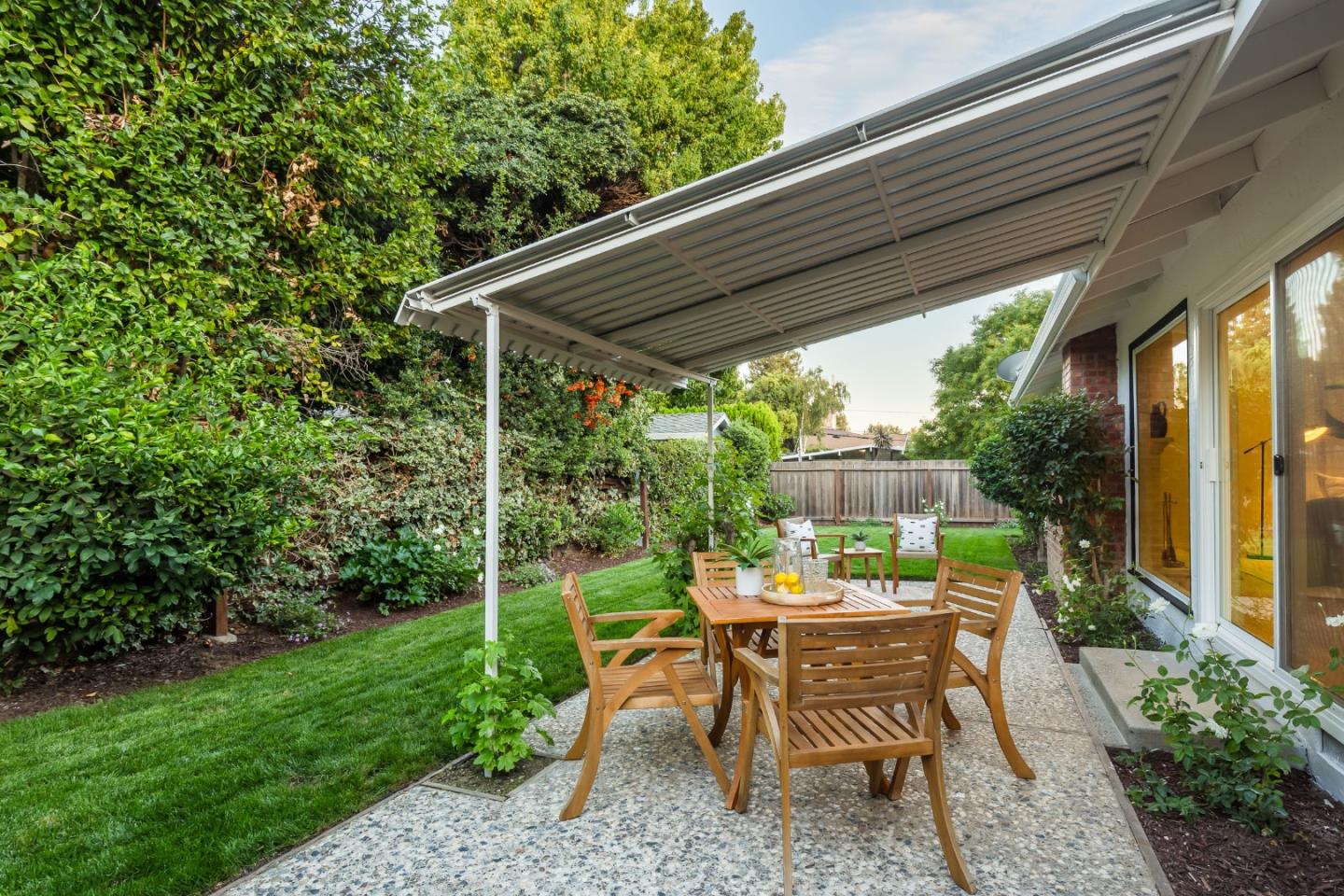 2498 Raleigh Drive San Jose, CA 95124 - Photo 16 of 17 a view of chair and table in patio with wooden fence