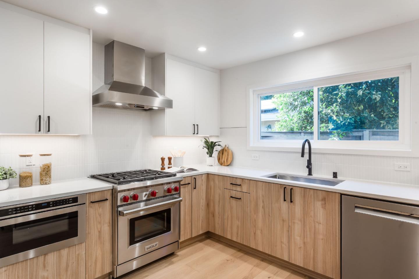 2498 Raleigh Drive San Jose, CA 95124 - Photo 3 of 17 a kitchen with stainless steel appliances a sink stove and cabinets