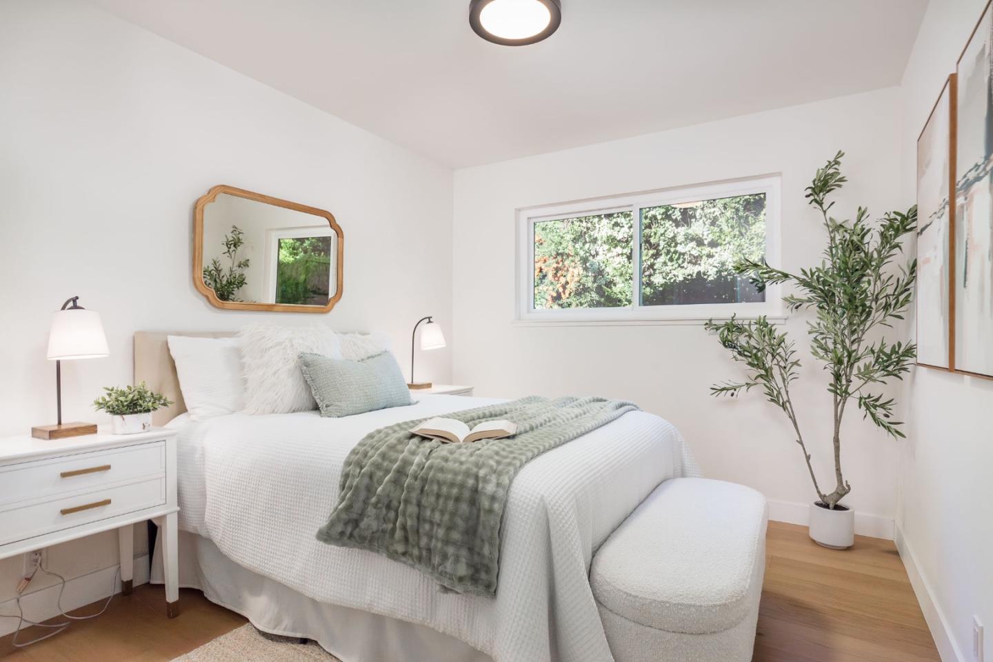 2498 Raleigh Drive San Jose, CA 95124 - Photo 7 of 17 a bedroom with a bed and a potted plant